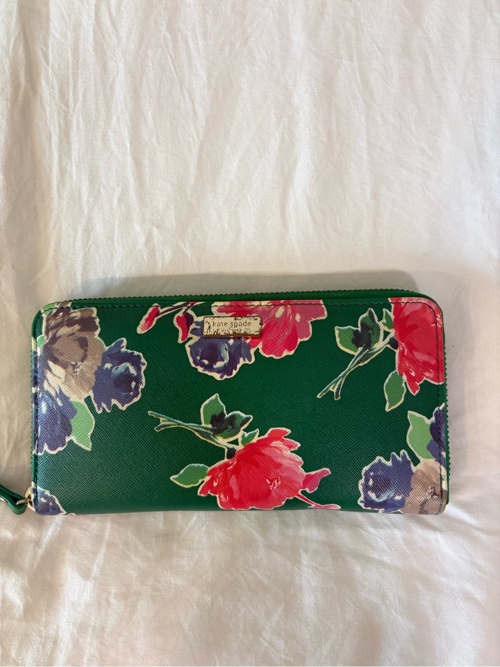 kate spade green floral zip-around wallet with multicolor blooms